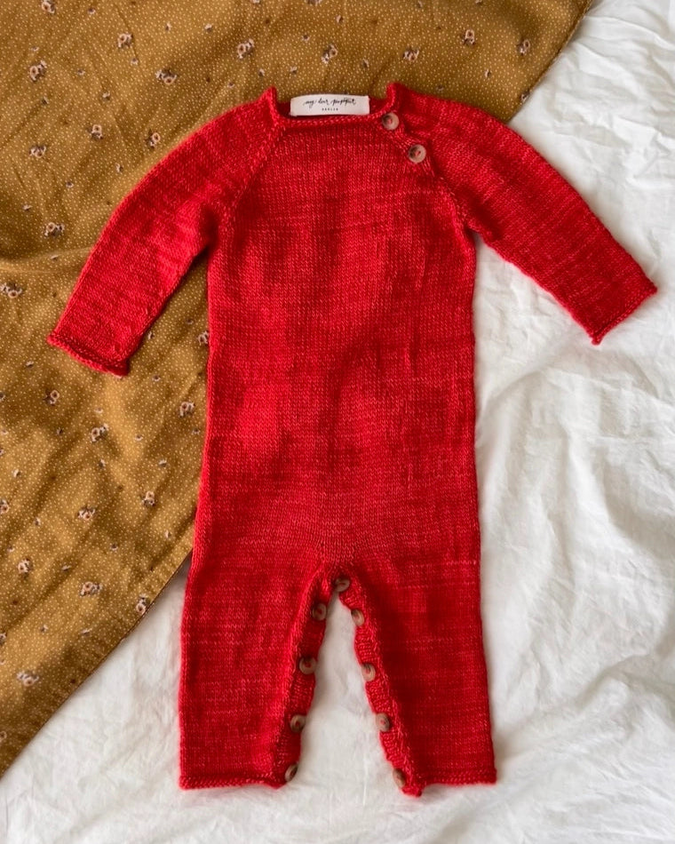 Produktfoto: Emma’s Suit, Strickanleitung für einen Babystrampler in Raglan von oben
