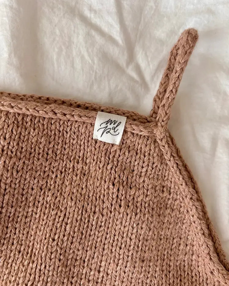 Produktfoto: Sylvie's Strampler, Strickanleitung für einen Sommer Babystrampler in Raglan von oben